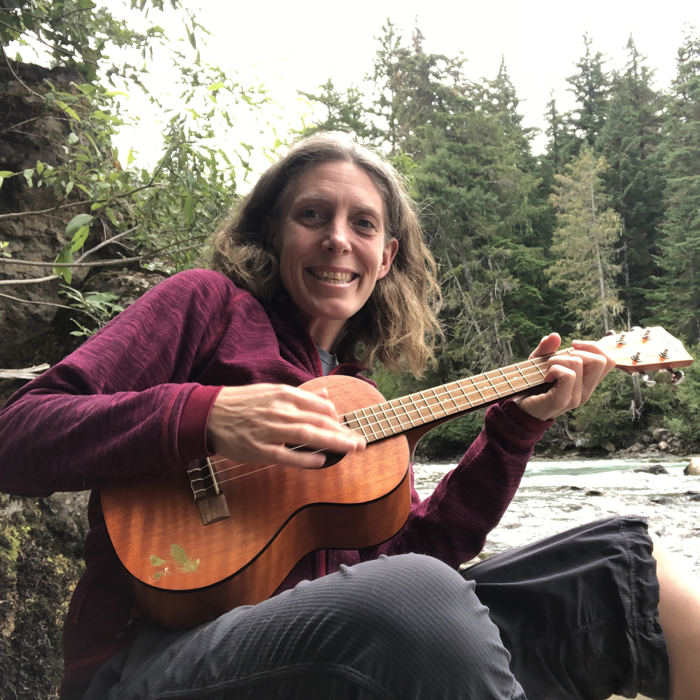 Julie playing a ukulele